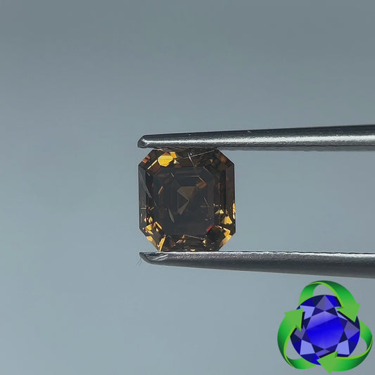 Emerald cut diamond: 1.03ct - Fancy Dark Orangy Brown I1